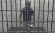na zdjęciu zatrzymany mężczyzna w celi