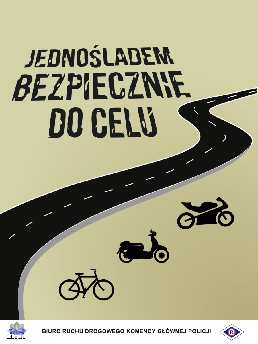 Na szaro-zieolnym  tle znajduje się kręta droga (jezdnia) w kolorze czarnym, a obok sylwetki motocykla, motoroweru i roweru w kolorze czarnym. U góry widnieje hasło: Jednośladem bezpiecznie do celu. 