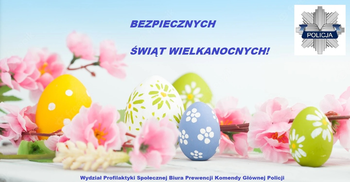 Napis Bezpiecznych Świąt Wielkanocnych umieszczony centralnie. W tle kolorowe pisanki wraz z kwiatami na gałązkach. W prawym górnym roku umieszczono LOGO Policji.