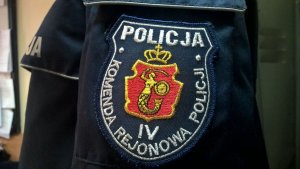 Napis: Policja Komenda Rejonowa IV