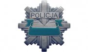 policyjna odznaka z napisem : Policja