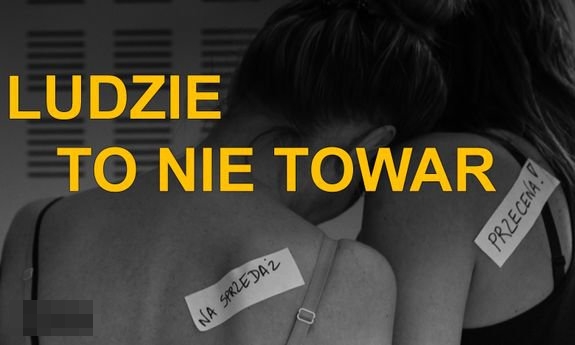 plakat przedstawiające stojące tyłem dwie kobiety i napis ludzie to nie towar