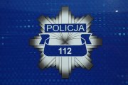 policyjna gwiazda z napisem Policja i numerem 112 na granatowym tle
