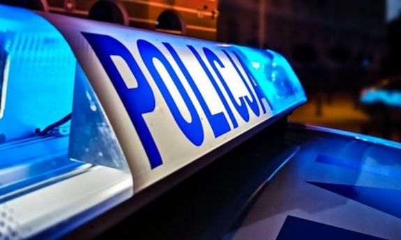 kolorowy sygnał świetlny z napisem policja