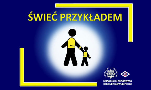 Plakat akcji Świeć przykładem. W środku widoczne są dwie czarne postacie - dorosłego i dziecka ubrane w kamizelki odblaskowe. Wokół rozprzestrzenia się blask. Dalej od środka na granatowym tle widoczny jest żółty napis: Świeć Przykładem. Poniżej po prawej stronie widać policyjna gwiazdę a wokół niej hasło: Pomagamy i Chronimy, obok logo ruchu drogowego. Obrazek wykończony jest częściowo żółtymi ramkami w prawym i lewym rogu.