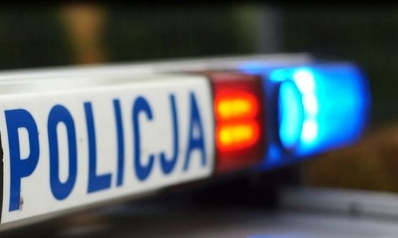 Sygnalizator świetlny na radiowozie z napisem Policja.