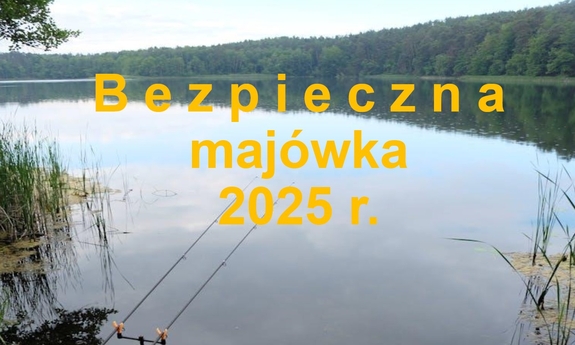 Grafika z napisem Bezpieczna majówka 2025 r. w tle jezioro.