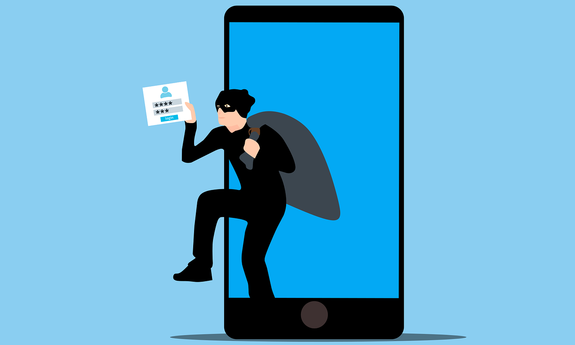 Grafika przedstawia smartfon i przestępce z workiem na plecach.